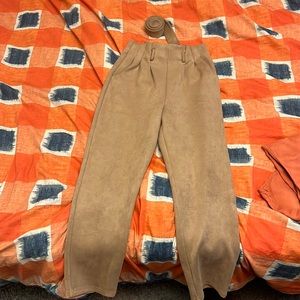Beige, soft, velvet pants with matching velvet belt.